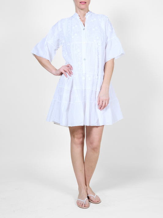 White Dress with Ruffle Details and Floral Embroidery