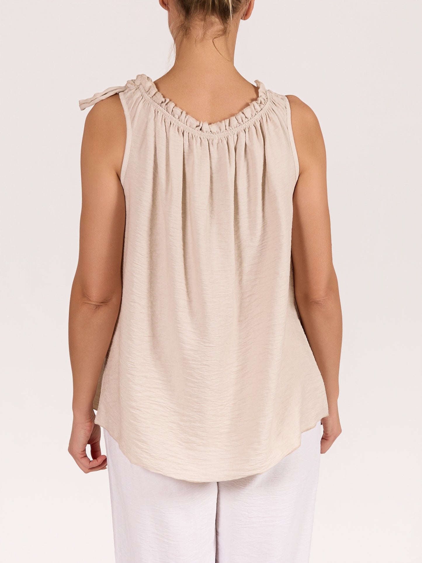 Beige Sleeveless Top with Ruffled Neckline and Side Tie