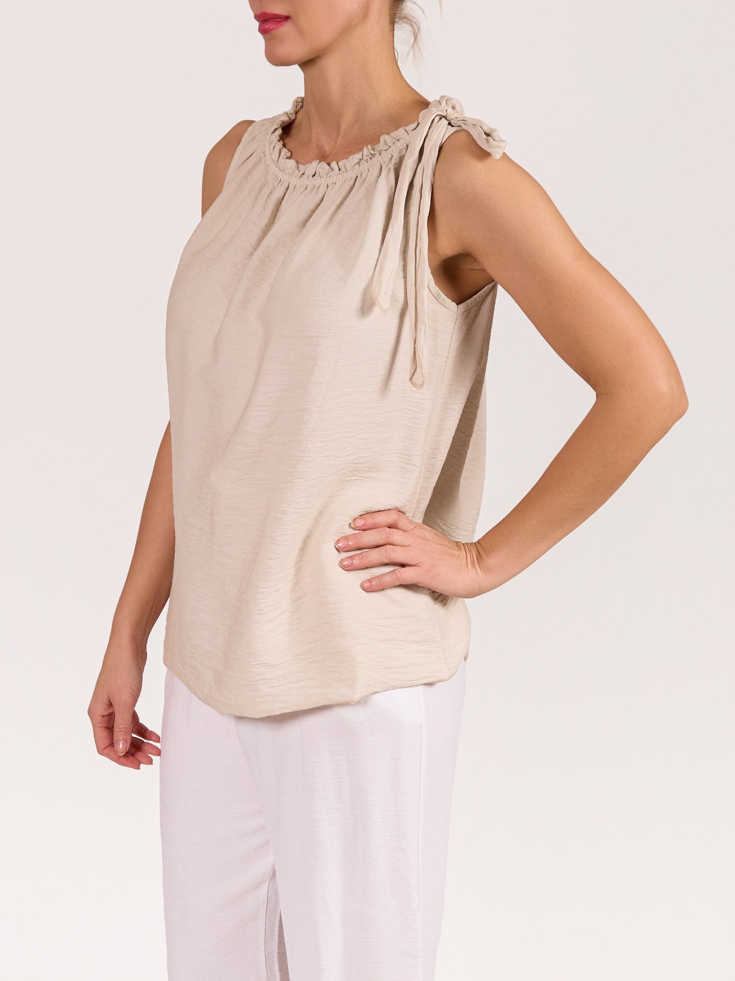 Beige Sleeveless Top with Ruffled Neckline and Side Tie